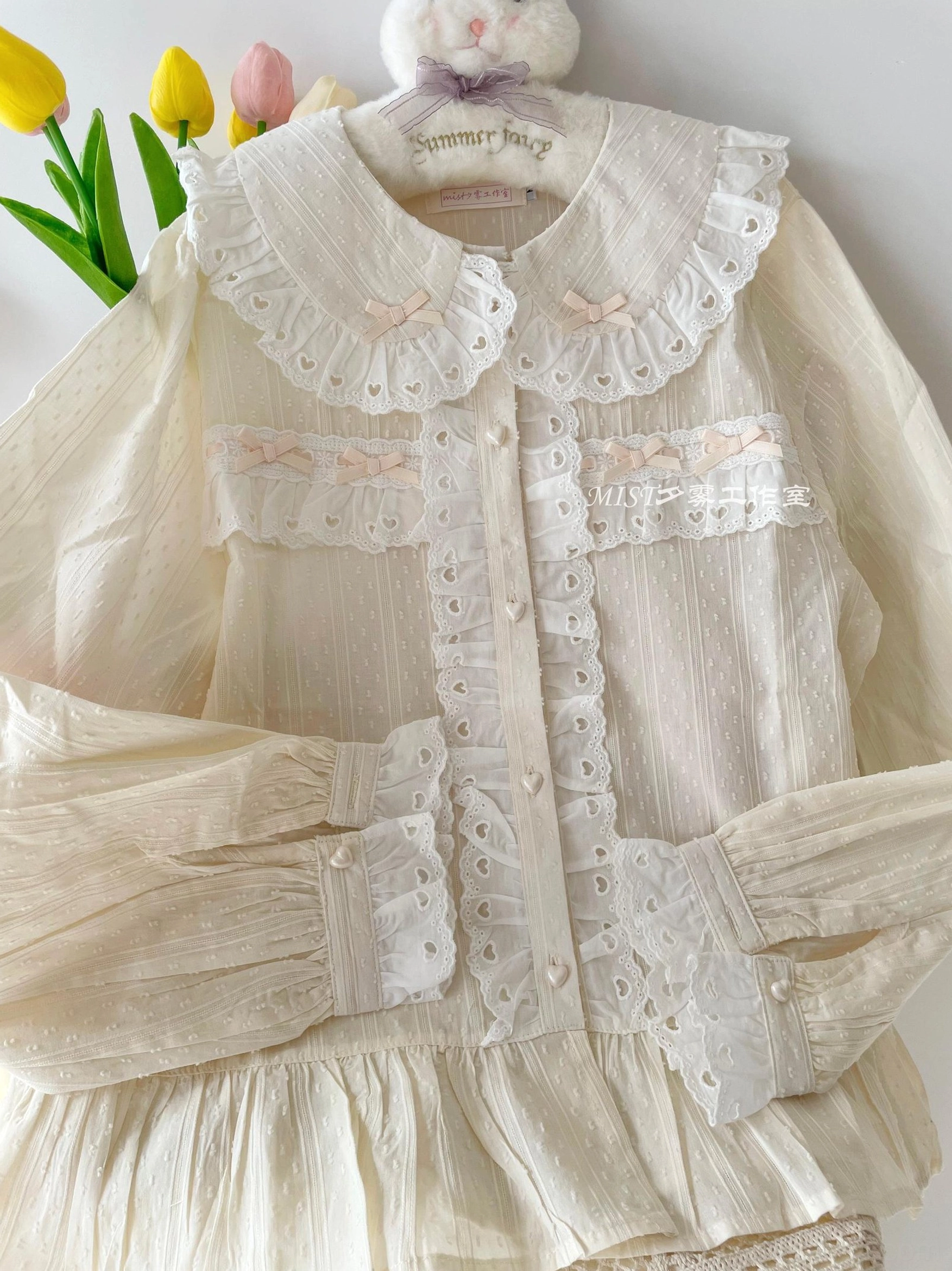 Beige sweet lolita blouse doll collar with embroidered lace stripe texture close-up detail