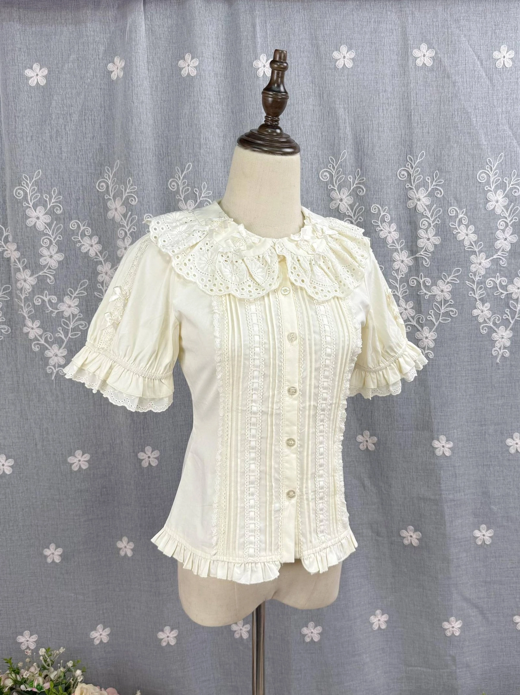 Beige Sweet Lolita Peter Pan collar blouse front flat display with embroidered hollow ruffled neckline and pleated bodice details