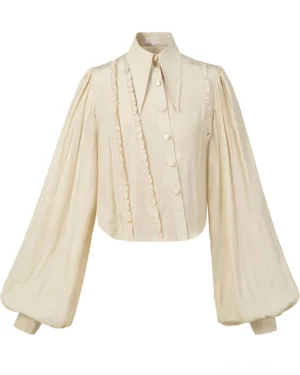 Starry Whispers vintage Lolita blouse in beige flat lay front view showcasing pointed collar lantern sleeves and diagonal ruffle button closure with embossed fabric texture