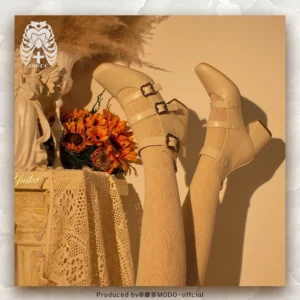 Beige matte leather vintage triple-buckle Mary Jane lolita high heels with square toe and chunky block heel, displayed on mannequin legs with retro lace tablecloth and sunflower decoration