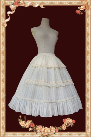 Beige white lolita tiered ruffle underskirt with layered hem front view on mannequin vintage studio backdrop