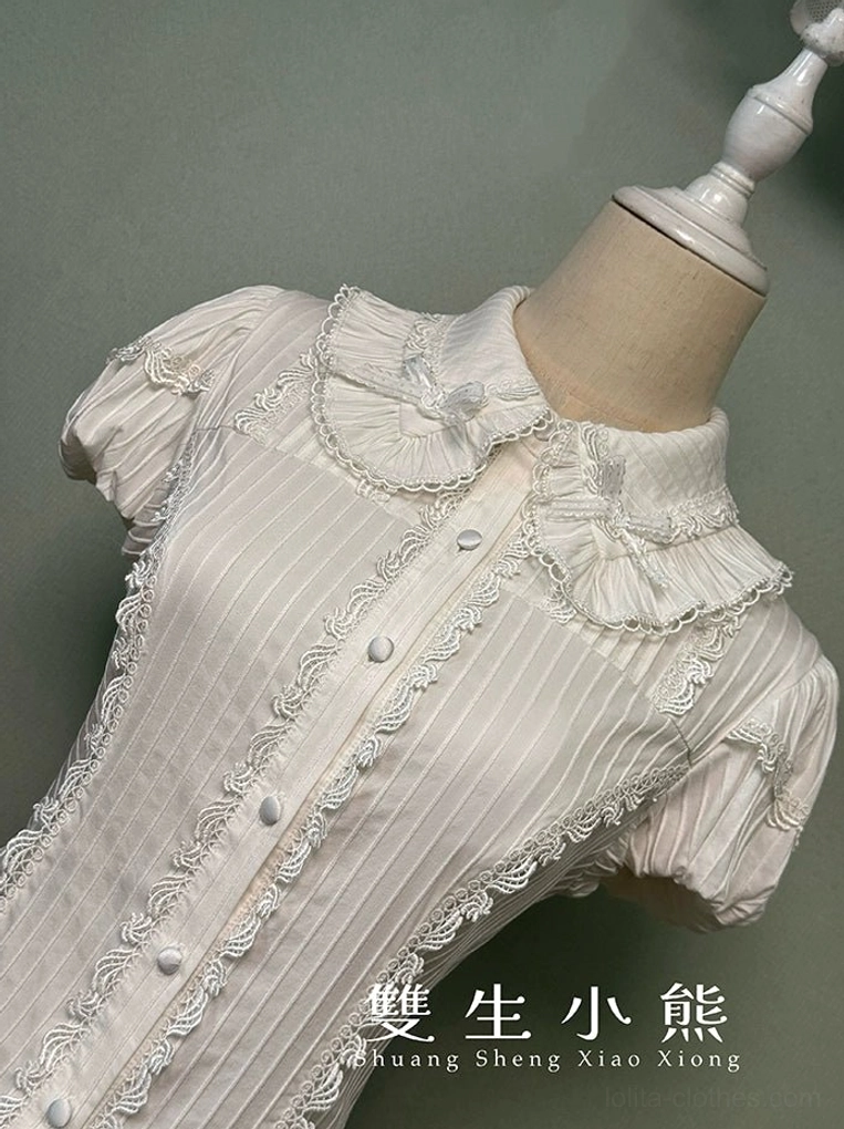Lolita blouse satin button closure and Peter Pan collar detail with cream-colored ruffles and scalloped edging on white sweet aesthetic background