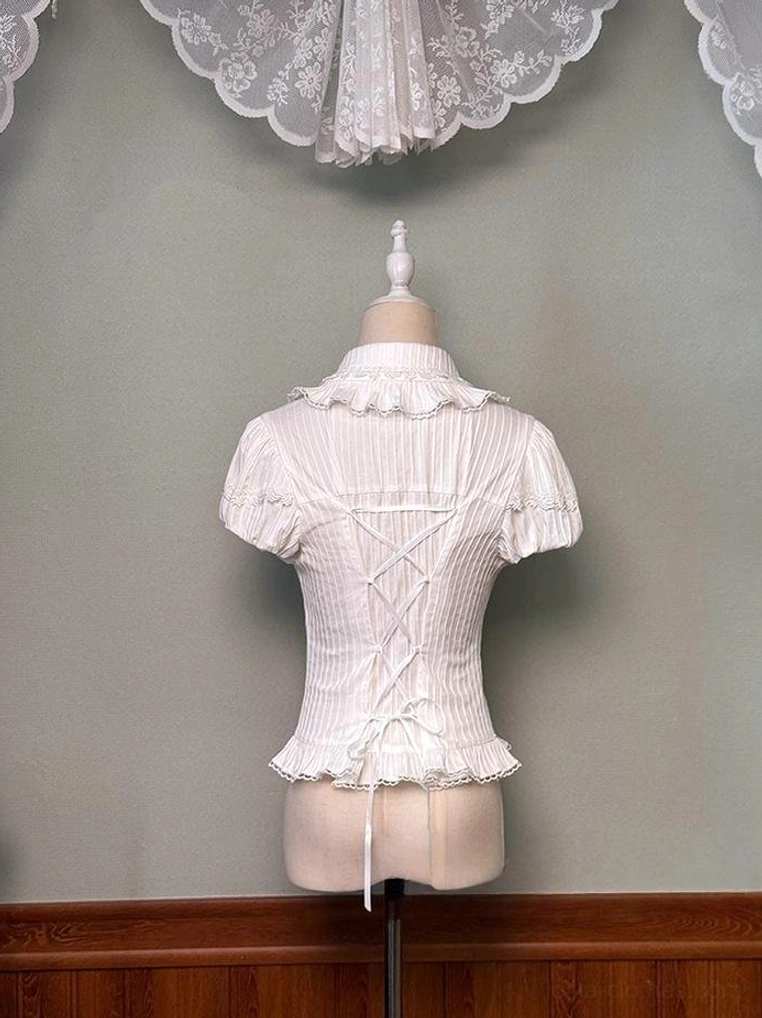 White sweet lolita blouse back view showcasing dramatic lace-up corset back design, ruffled Peter Pan collar, and vertical stripe texture on mannequin display
