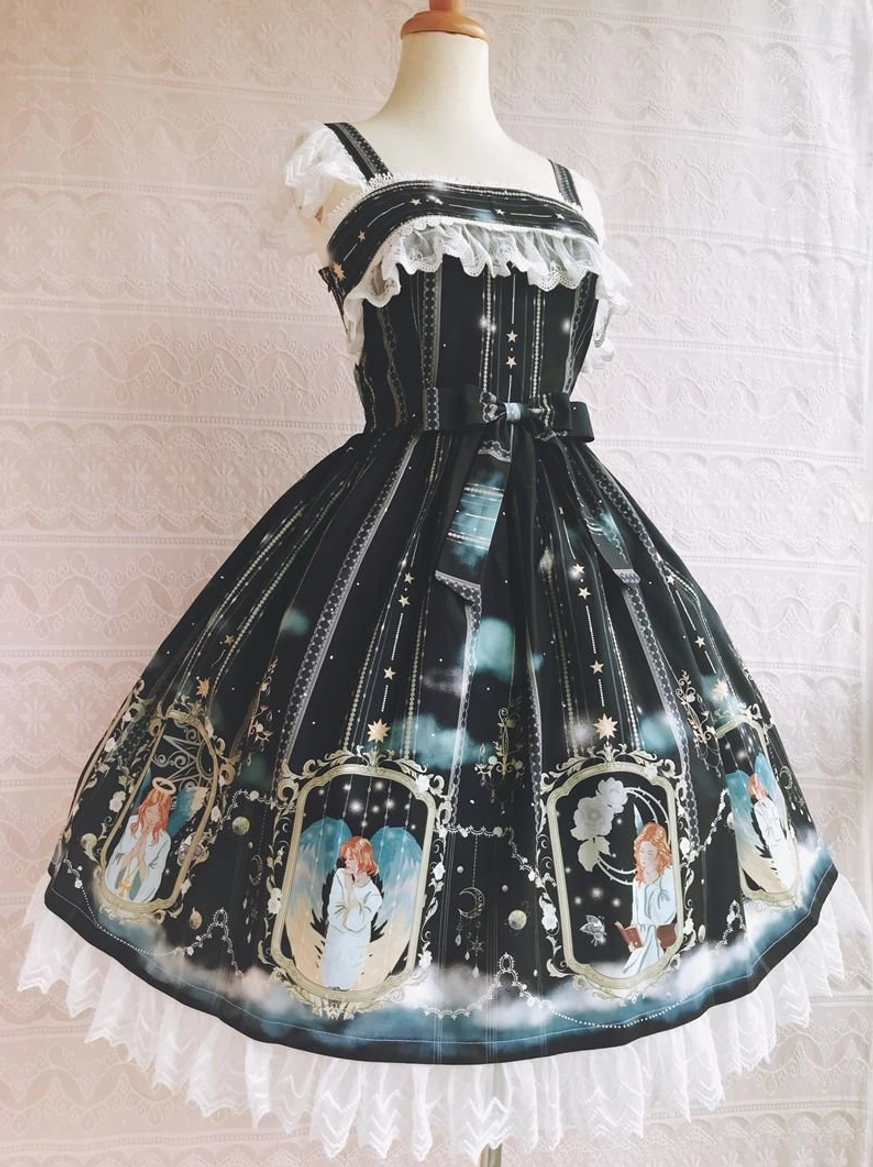 Black angel print Lolita jumper skirt with lace hem and mirror-framed angel prints, stripe and star design - front angled view