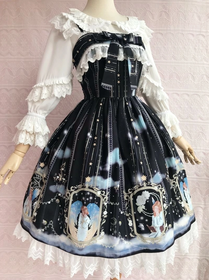 Black angel-themed Lolita JSK with oversized bow and mirror-framed angel skirt prints - front three-quarter mannequin view