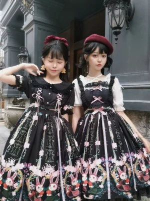 Black Bunny Garden Lolita JSK Jumperskirt with white ruffled sleeves and floral rabbit print hem worn with white socks and Mary Jane shoes in European vintage street setting