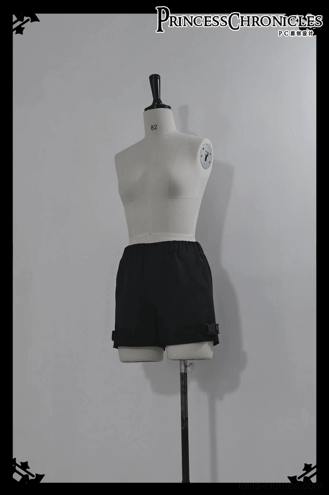 Black cargo inner shorts with adjustable side buckles and elastic waistband techwear design