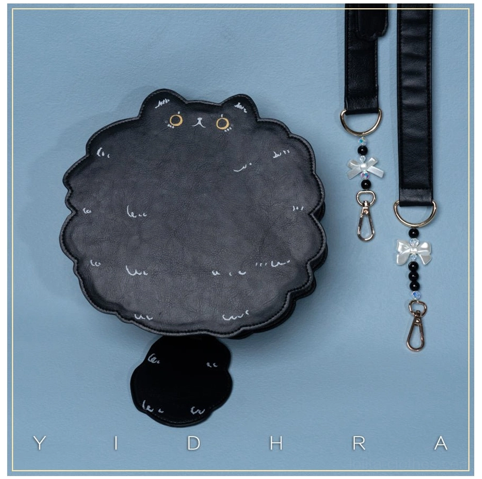 Black cat kawaii shoulder bag with detachable feline tail decoration adding playful whimsy to gothic lolita fashion styling