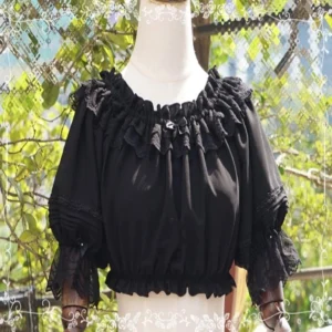 Black retro chiffon Lolita round collar blouse with multi-layered lace ruffled neckline and pleated puff sleeves displayed on wooden dress form in outdoor garden setting