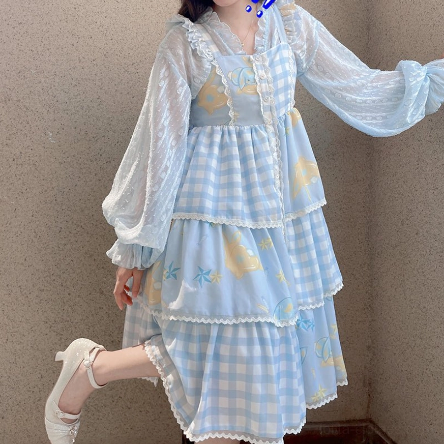 Black sheer chiffon puff sleeve sweet Lolita cardigan with ruffled V-neck and front bow styled over red strawberry print skirt full body