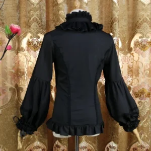 Black classic Lolita blouse back view on dress form showing fitted waist, ruffled high neckline, adjustable bell sleeves with drawstring tightening, and layered hem with vintage floral backdrop