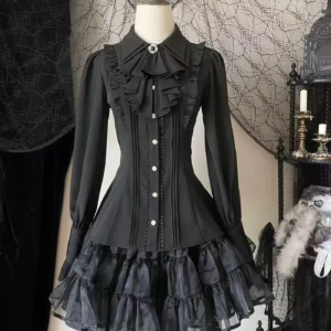 Black classic lolita blouse with bishop sleeves and ruffled jabot collar displayed on dress form with vintage gothic home decor background