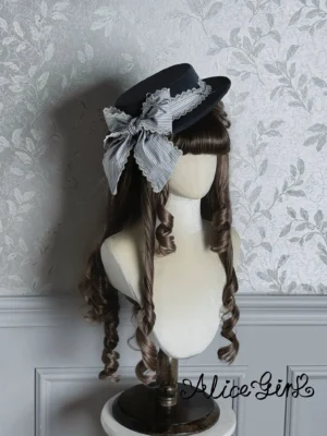 Black classic lolita flat top hat with grey striped satin bow and lace trim on curly wig mannequin vintage aesthetic