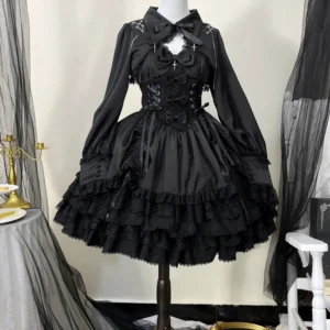 Black Cross Medal Gothic Lolita JSK dress with matching long-sleeve bolero, front view on dress form displaying lace-up corset waist, cross chest ornament, and multi-layered ruffled lace skirt