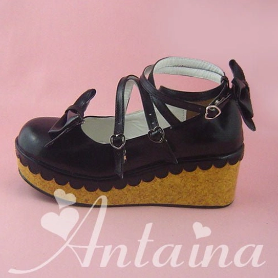 Black Lolita platform shoes with double color sole detail showing black upper and contrasting platform sole, cross ankle straps with heart buckles, and bow toe decoration