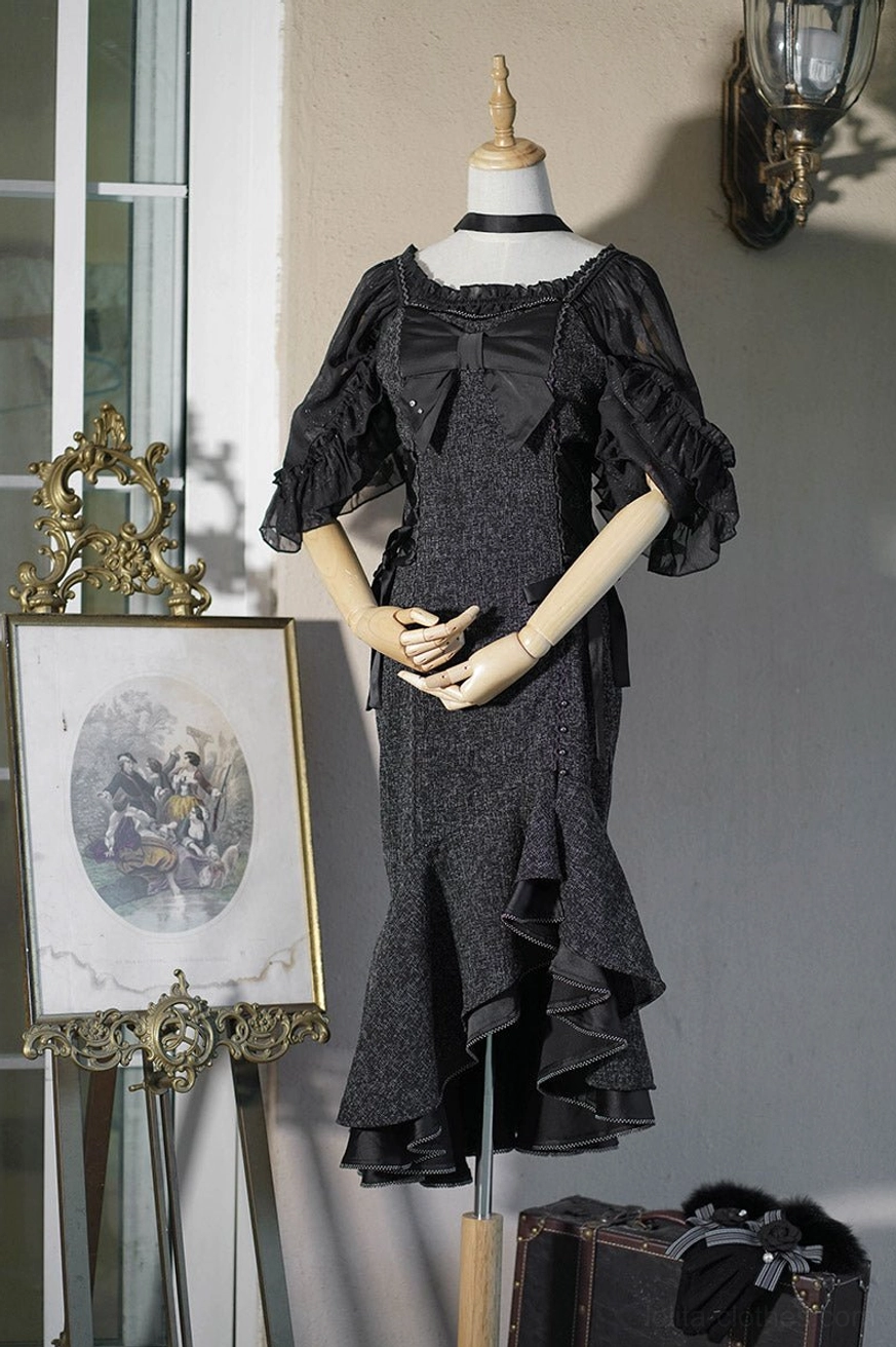 Black fishtail Lolita JSK dress detail shot highlighting ruffled hem construction, side split design and spaghetti strap elements that characterize this jumper skirt