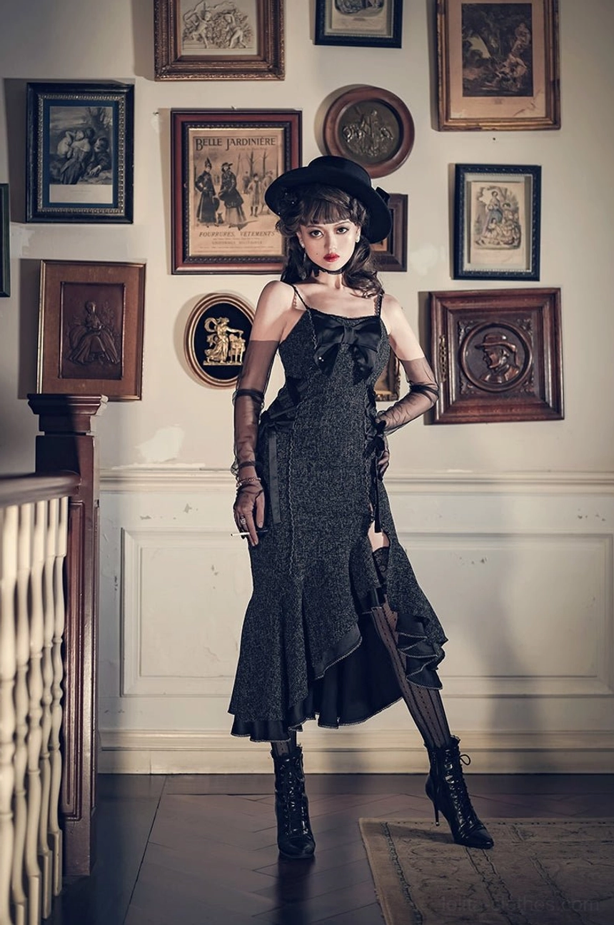 Solid black fishtail slip Lolita jumper skirt with spaghetti straps and high side slit, elegant slim silhouette in art gallery setting with mesh gloves and ankle boots