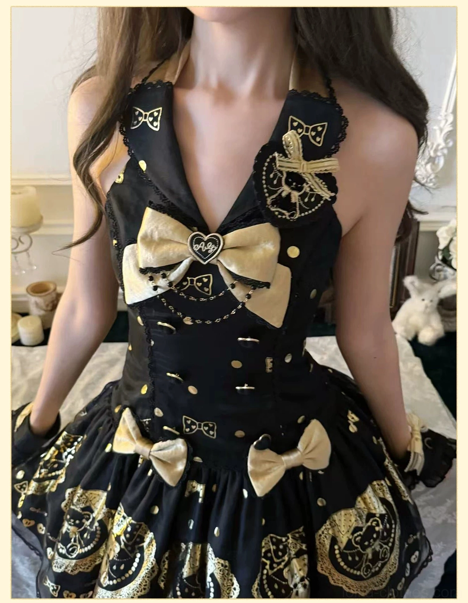 Final detailed view of black and gold bear print lolita dress highlighting all design elements including hot-stamped patterns, lace embellishments, bows, and classic old school craftsmanship