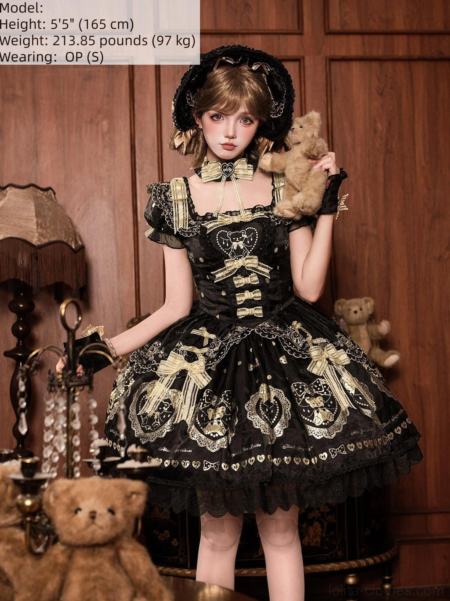 Black and gold bear print lolita dress on mannequin displaying full silhouette, voluminous skirt structure, lace embellishments, and classic doll-like old school lolita aesthetic