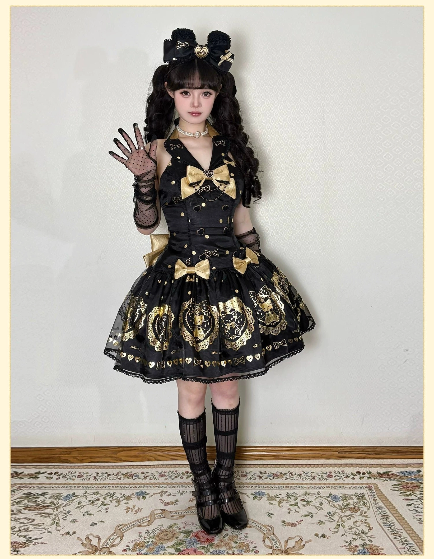Size comparison display showing multiple sizes of black and gold bear print lolita dress on dress forms, illustrating inclusive sizing range from XS to XL and silhouette consistency