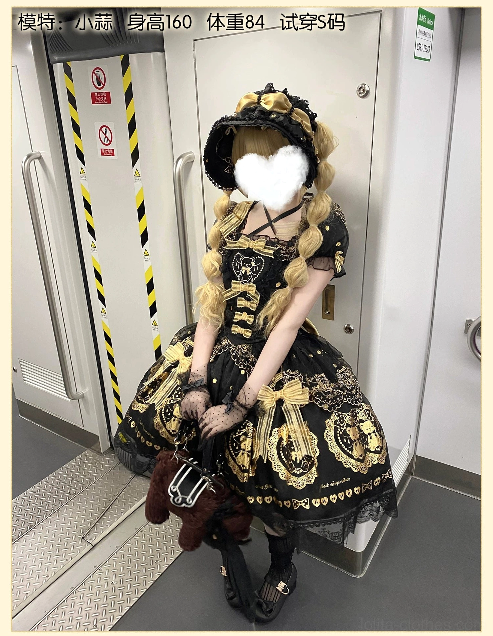 Side seam and construction detail of black and gold bear lolita dress on form, showing precision seaming, lace-up closure functionality, and high-quality tailoring standards