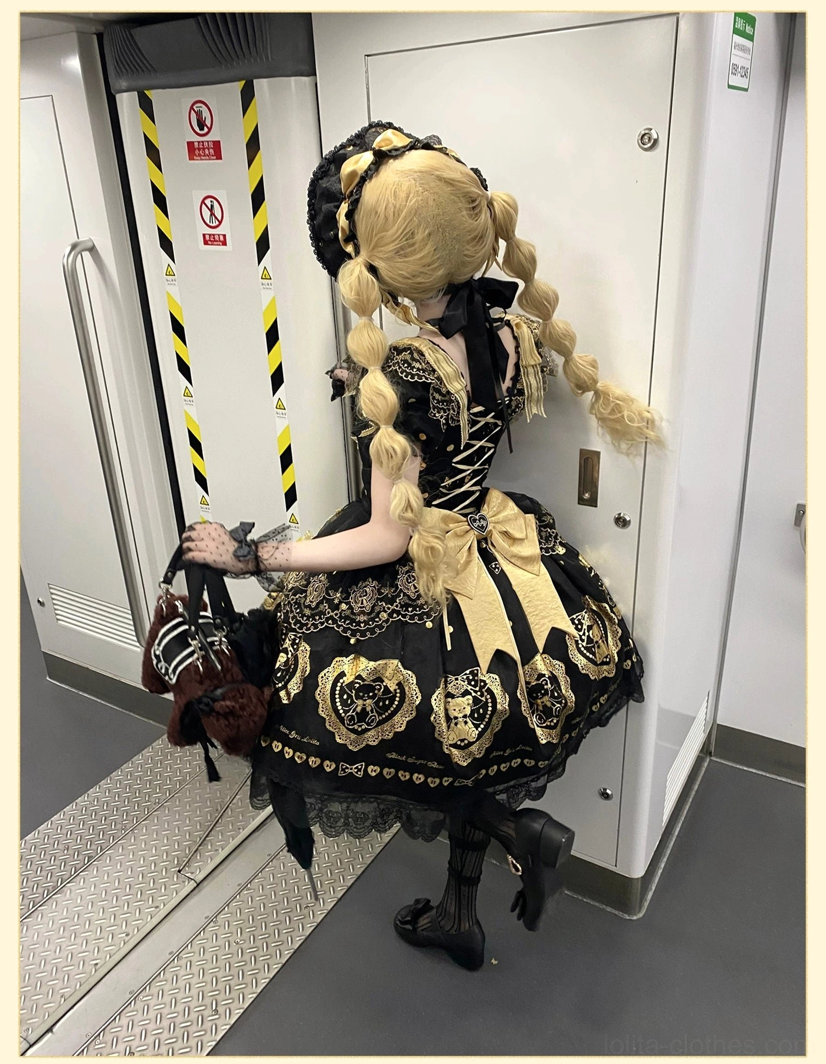 Full body back view of OP dress version on model showing how lace-up back corset design creates elegant silhouette, shirring panels adjust to different sizes, and skirt drapes beautifully