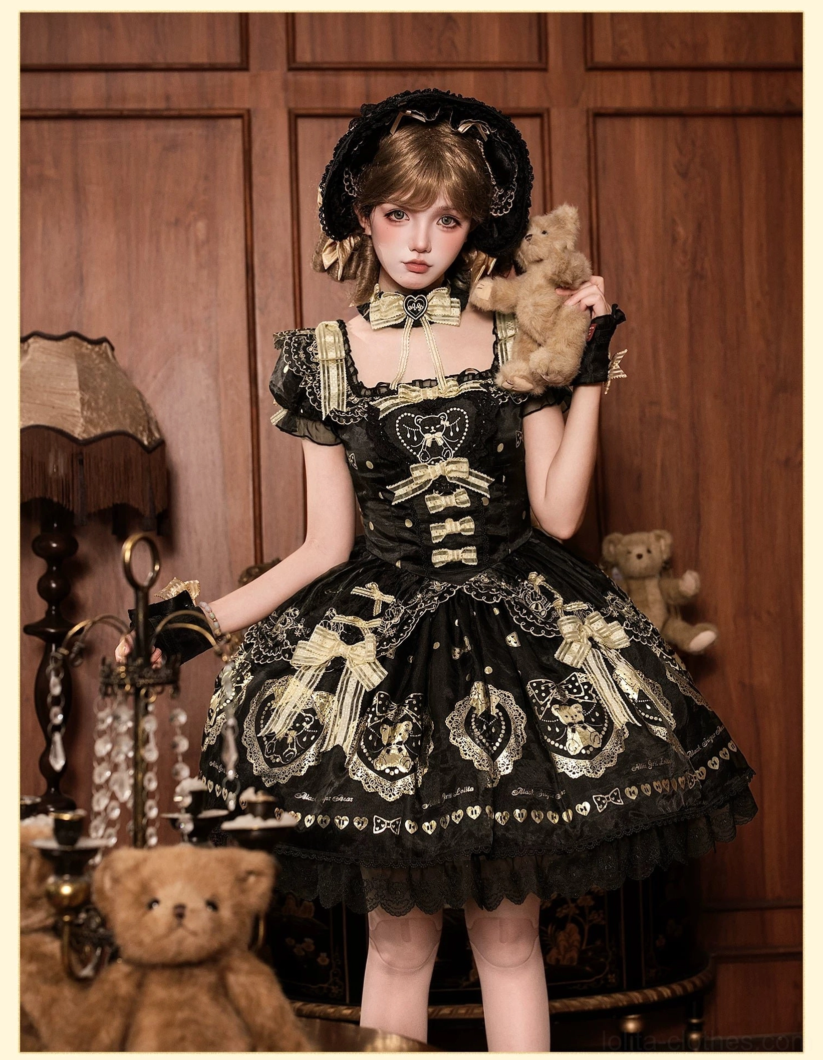 OP dress version of black and gold bear print lolita with short sleeves, displayed on form showing sleeve length, waistline structure, lace-up back corset, and classic one-piece silhouette