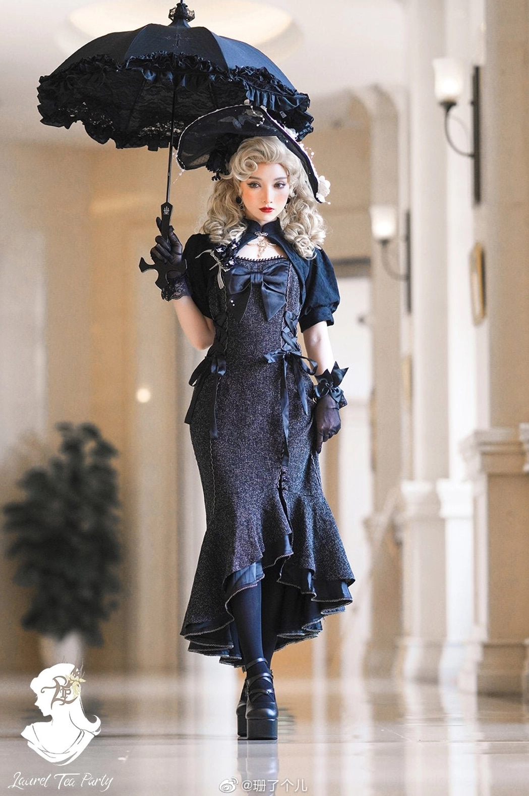 Black gothic fishtail lolita JSK dress with matching cropped bolero, glitter fabric and ruffled hem, paired with vintage hat and black parasol for classic Lolita styling