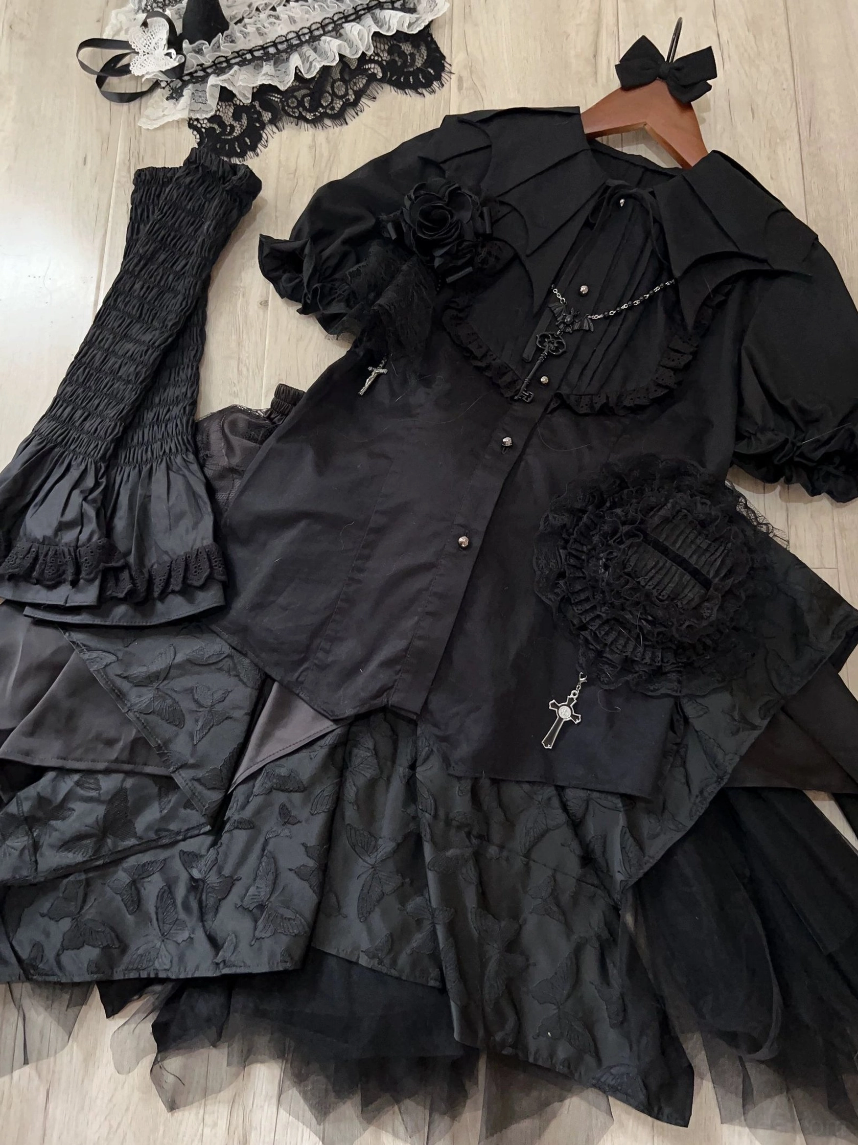 Black Gothic Lolita bat-collar shirt with detachable jabot - close-up detail of collar construction and jabot attachment mechanism showing craftsmanship quality