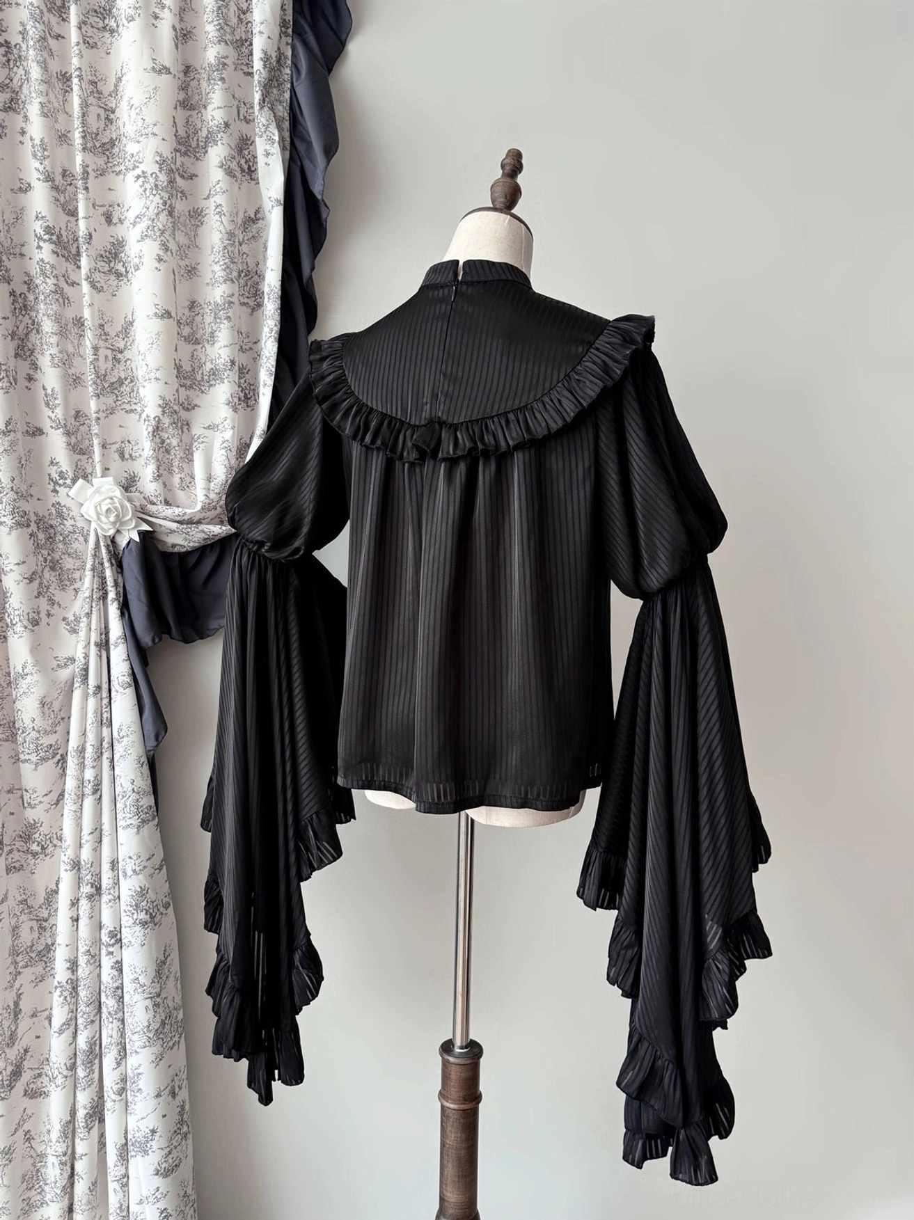 Black gothic lolita striped blouse back full view with vertical stripe pattern, ruffled shoulder trim, and simplified back design