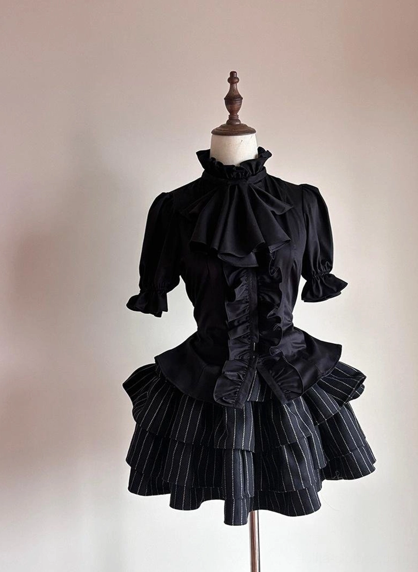 Solid black Gothic Lolita short-sleeved ruffled blouse with stand collar large bow and front ruffle button placket paired with black pinstriped ruffled skirt