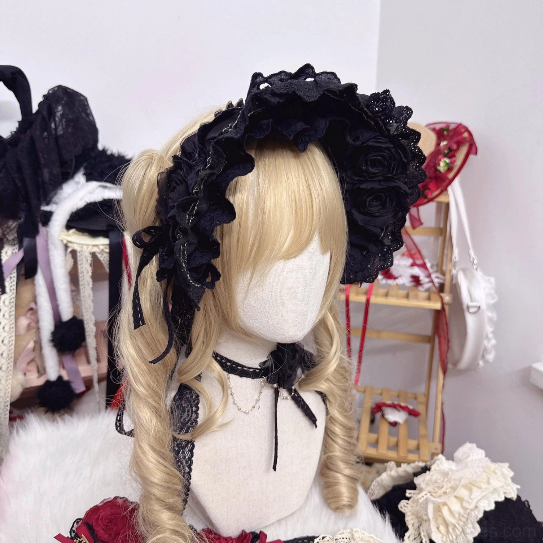 black lolita bonnet with roses and matching black choker neck accessory right side front view