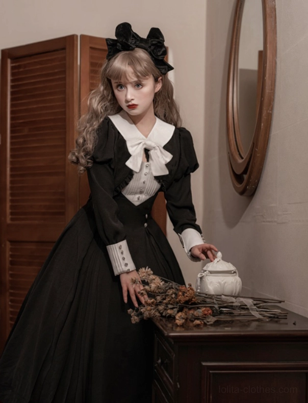 Black Lolita one-piece dress and matching coat collection styled together for outdoor photography session, demonstrating practical use case for Lolita fashion enthusiasts