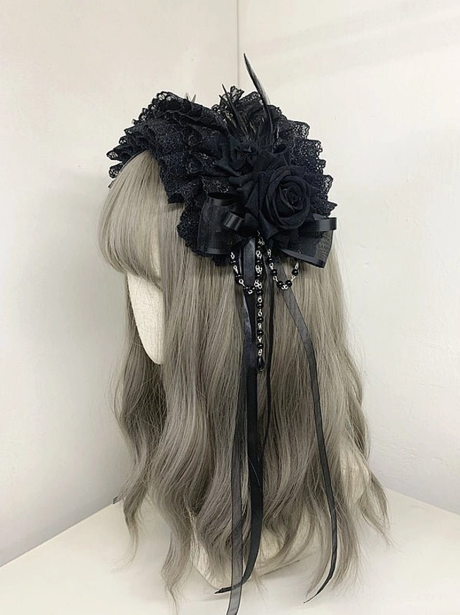 Black gothic lolita lace headdress with black silk roses ruffled lace beaded satin ribbon tassels rear three-quarter view mannequin