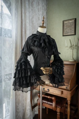 Black Gothic Lolita blouse with hime trumpet sleeves and multi-layer lace jabot front view mannequin display vintage study setting