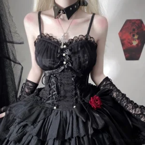 Black gothic lolita jumper skirt dress with lace-up corset and pearl accents close-up