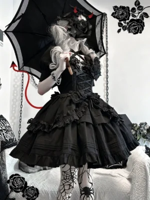 Black Gothic Lolita short jumper dress JSK front three-quarter view with devil tail and lace parasol accessories