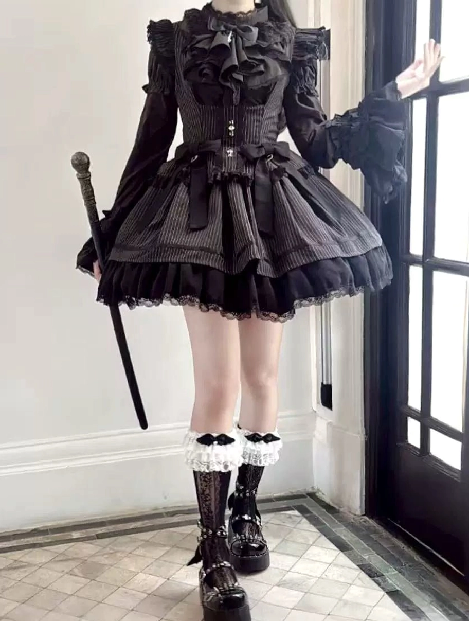 Black gothic lolita mini dress with structured corset waist flared ruffled skirt and gothic accessories side view