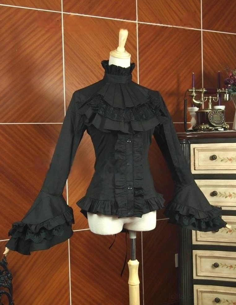 Black gothic lolita ruffled blouse dress form display front full view, high neck ruffle trim detachable jabot flared trumpet sleeves fitted silhouette