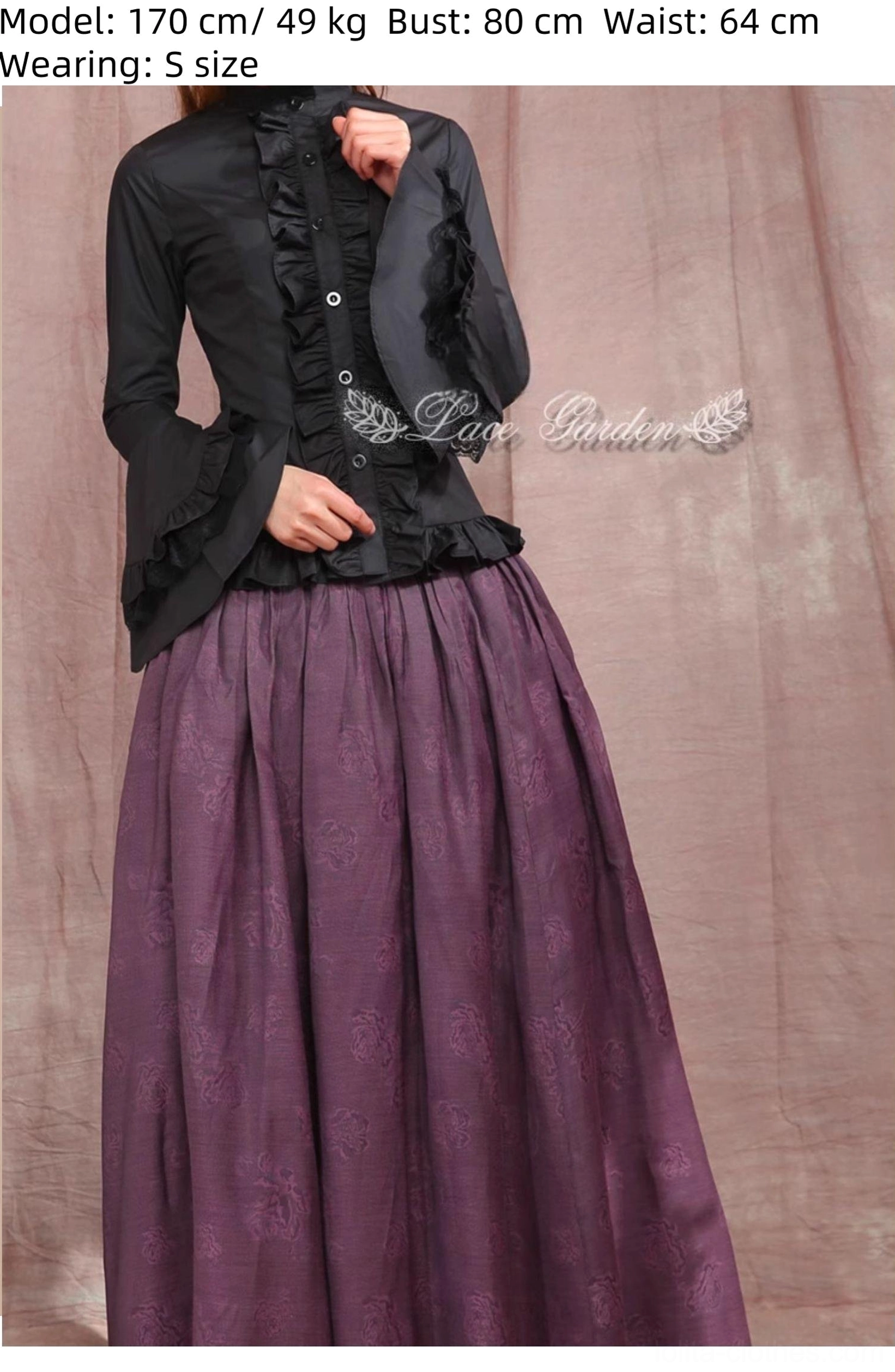 Black gothic lolita ruffled blouse front three-quarter view on model, slim tailored silhouette ruffled jabot flared sleeves front button closure