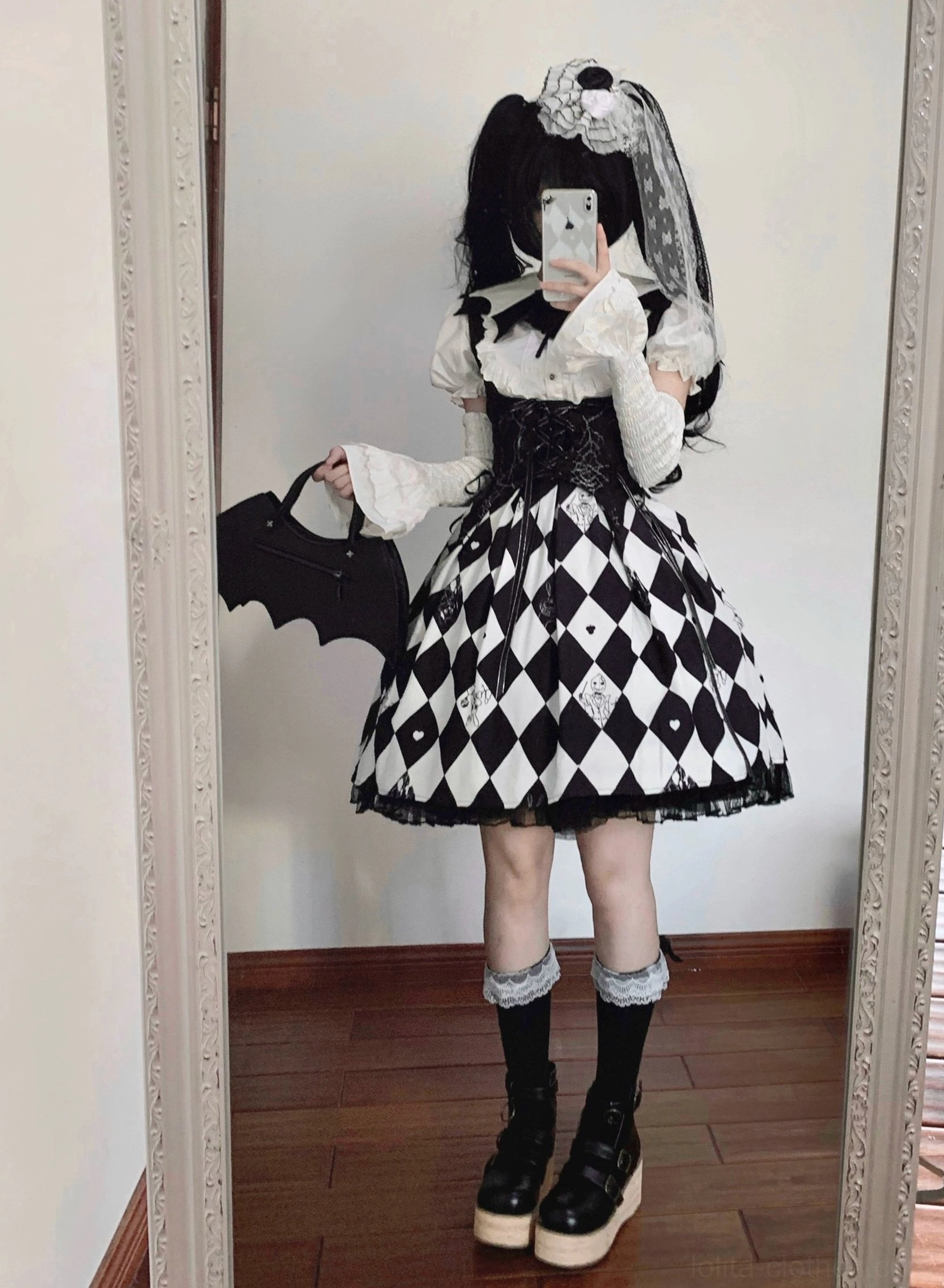 Black Gothic Lolita bat-collar shirt with large pleated detachable jabot, short puff sleeves, and solid black fabric on dress form