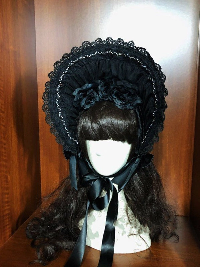 Black gothic lolita velvet half bonnet frontal display showing complete design with beaded lace brim, decorative satin flowers, satin chin bow and rich velvet finish