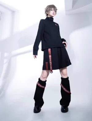 Side profile view of black Gothic Lolita cargo shorts and leg warmers set showing red letter print webbing accent detail and loose Ouji silhouette with leather shoes