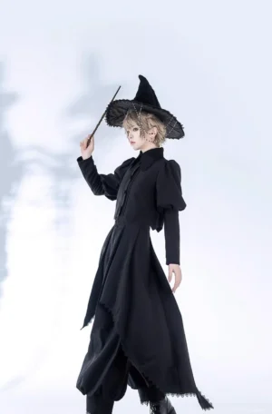 Black gothic sorcerer lolita witch ensemble full body front view model wearing retro coat with mutton sleeves lapel collar asymmetrical hem and ninth length pants with detachable trailing