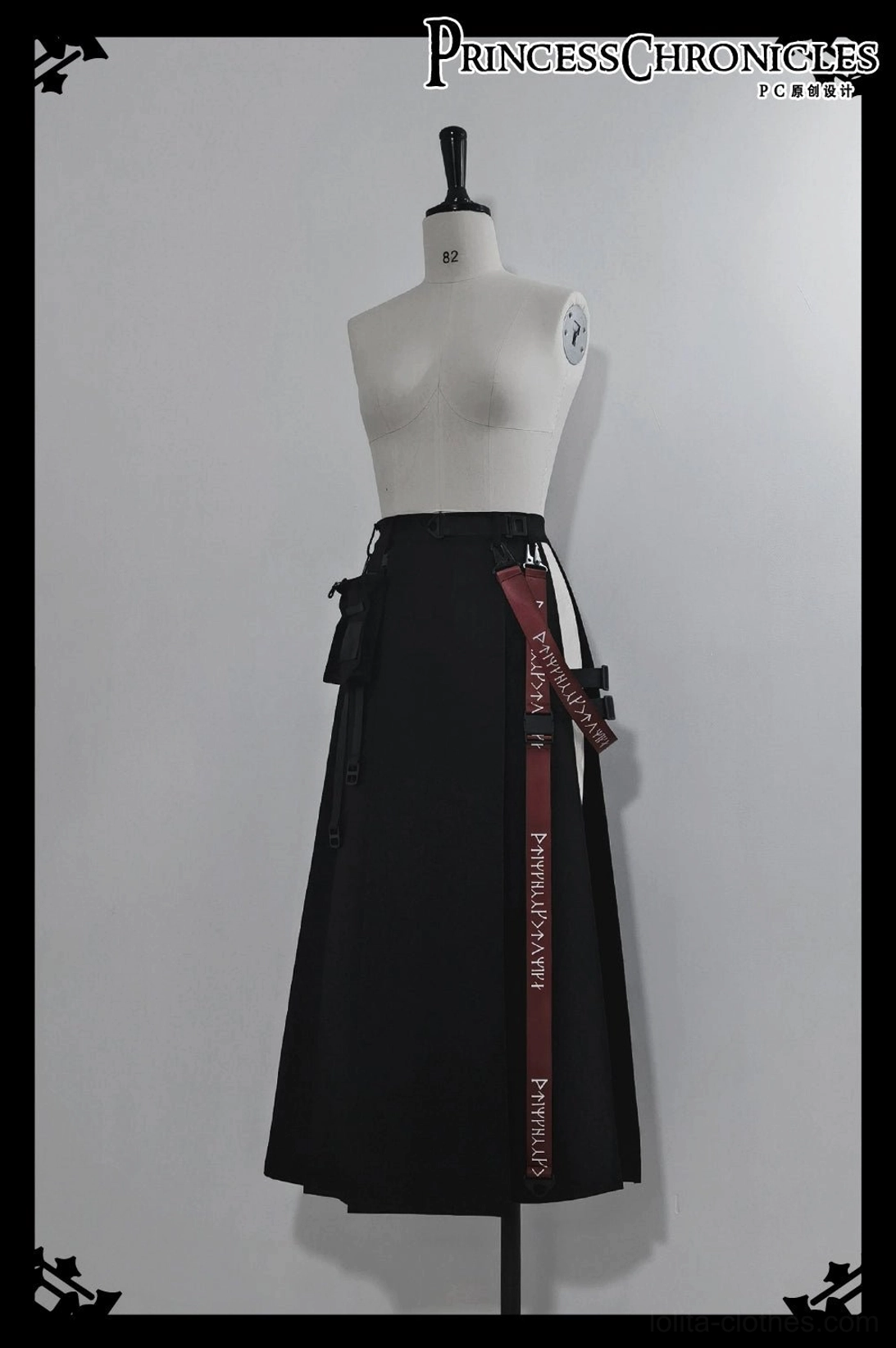 Black inner shorts product detail showing elastic waistband adjustment buckles and minimalist design