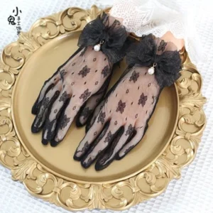 Black vintage lace Lolita gloves featuring sheer dark floral prints with ruffled lace cuffs and black bowknot decor with pearl pendant detail