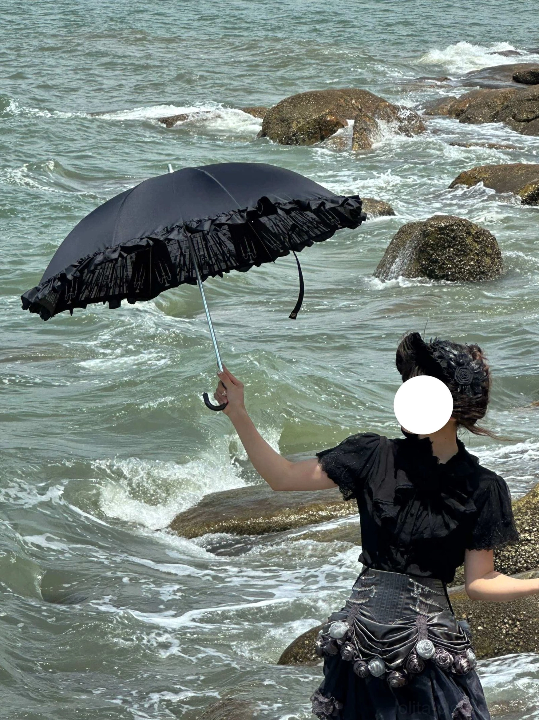 Black lace-print window pattern Lolita parasol with semi-transparent light-transmitting fabric and ruffled canopy edge, flat lay display on neutral background