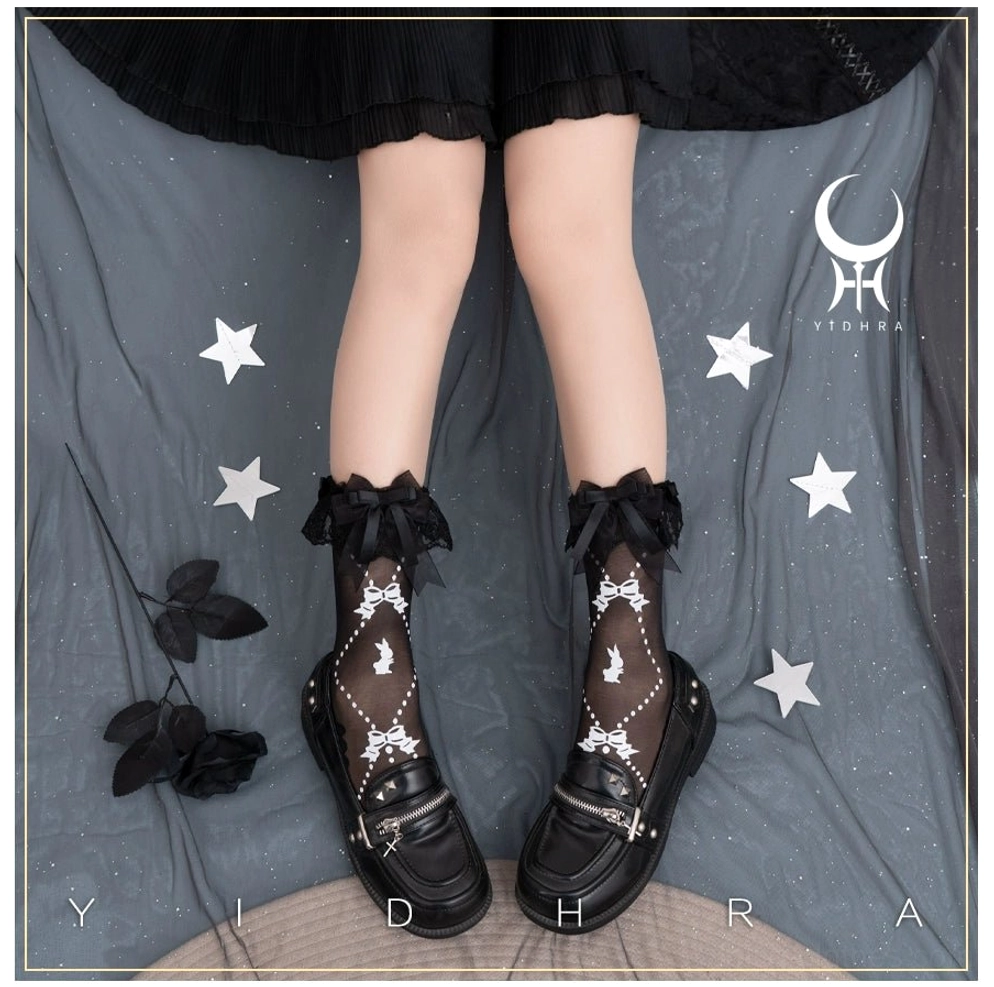 Black lolita ankle socks with detachable ruffled black lace bow cuff showing white bear and bow printed patterns on sheer black fabric