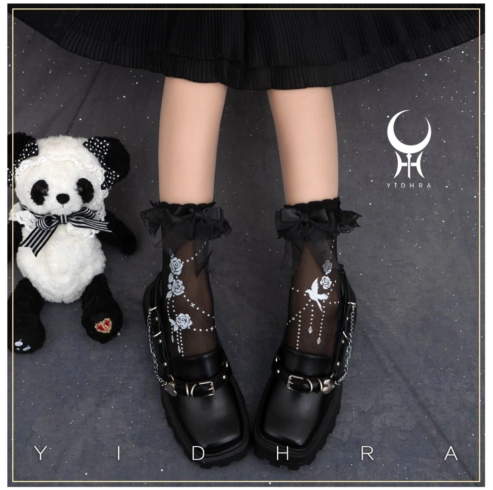 Black sheer Lolita ankle socks with ruffled lace cuff paired with classic black leather loafers and panda plush toy floral bird print details