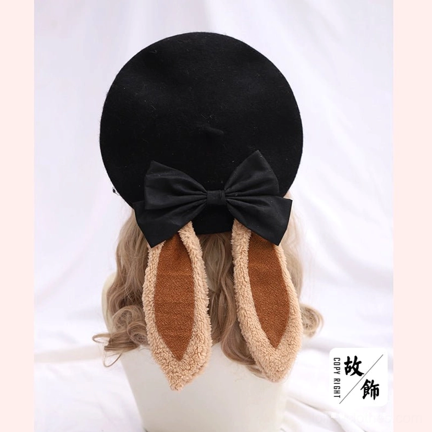 Black lolita beret with white fuzzy edged bunny ears and black satin bow accent - rear display mannequin